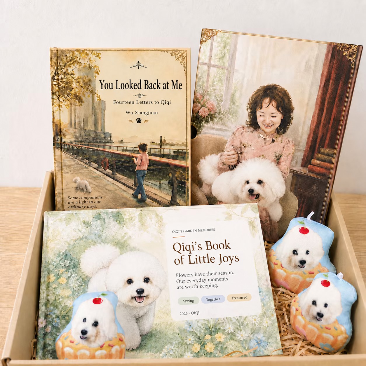 A presentation of a personal letter book, a photo album, a portrait and small pet-themed keepsakes